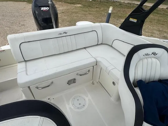Slide: The Image of 2014 Sea Ray 220 SD Outboard boat interior with white seating and 250 HP engine. - 13
