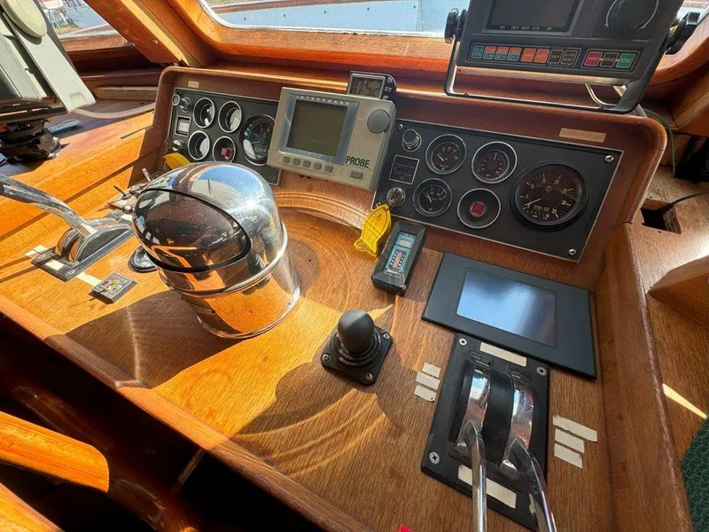 Slide: The Image of Cockpit of 1980 Ocean Alexander 50 MK1 yacht with navigation instruments and controls. - 22