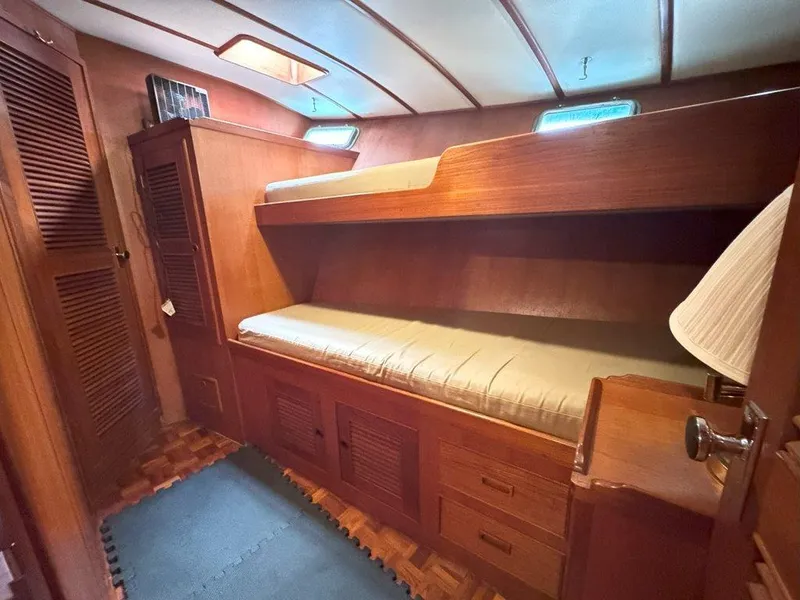 Slide: The Image of Interior cabin of 1980 Ocean Alexander 50 MK1 yacht with wooden bunk beds. - 30