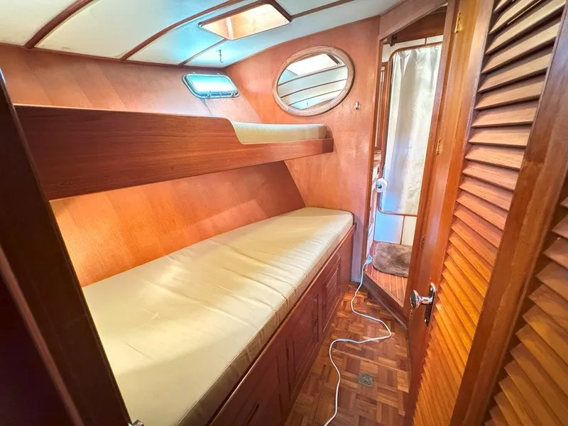 Slide: The Image of 1980 Ocean Alexander 50 MK1 cabin with wooden interior and bunk beds. - 32