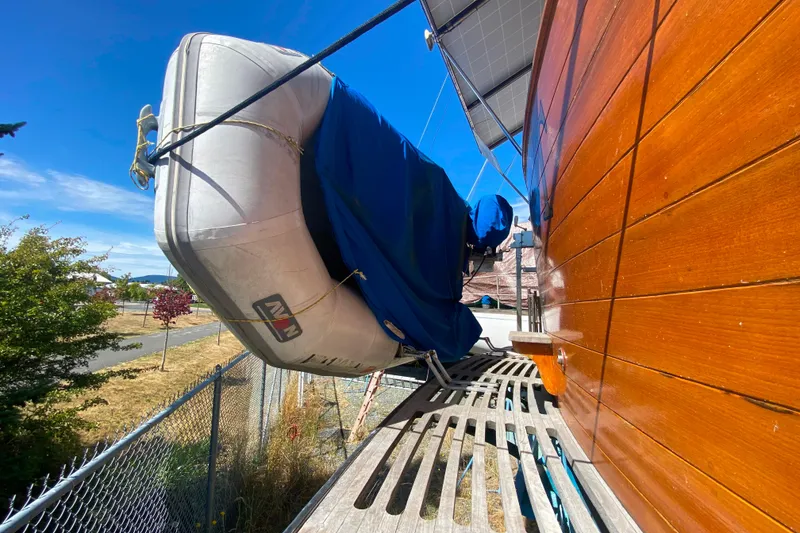 Slide: The Image of Inflatable boat secured on 1980 Ocean Alexander 50 MK1 yacht, sunny day. - 56