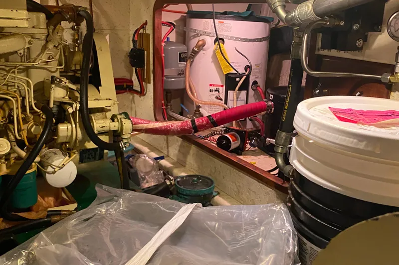 Slide: The Image of Engine room of 1980 Ocean Alexander 50 MK1 yacht with machinery and equipment. - 59