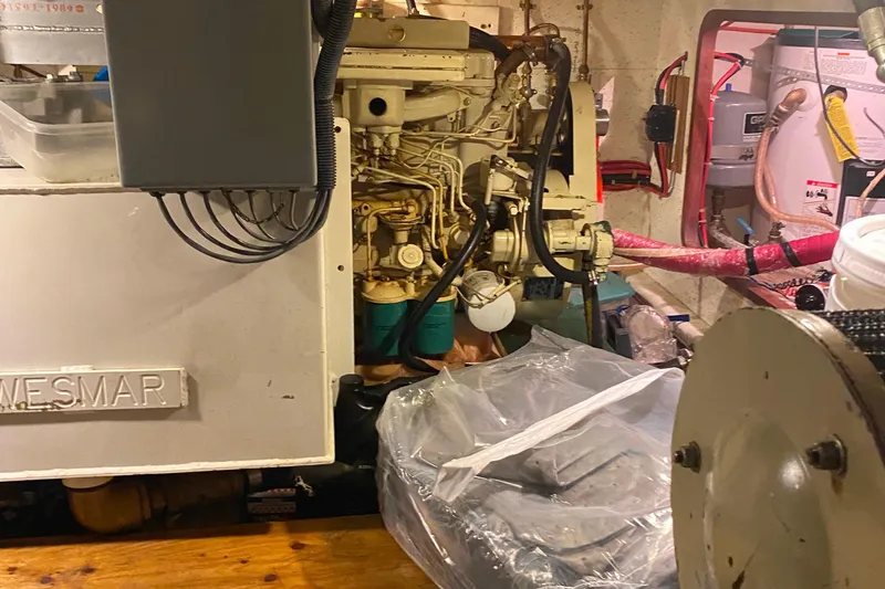 Slide: The Image of Engine room of 1980 Ocean Alexander 50 MK1 yacht with visible machinery and equipment. - 61