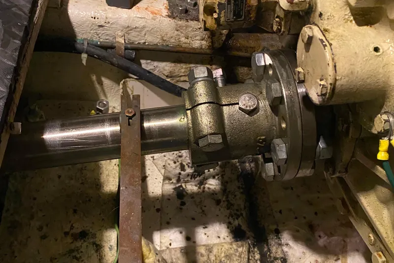 Slide: The Image of Engine room detail of a 1980 Ocean Alexander 50 MK1 yacht, showing mechanical components. - 65