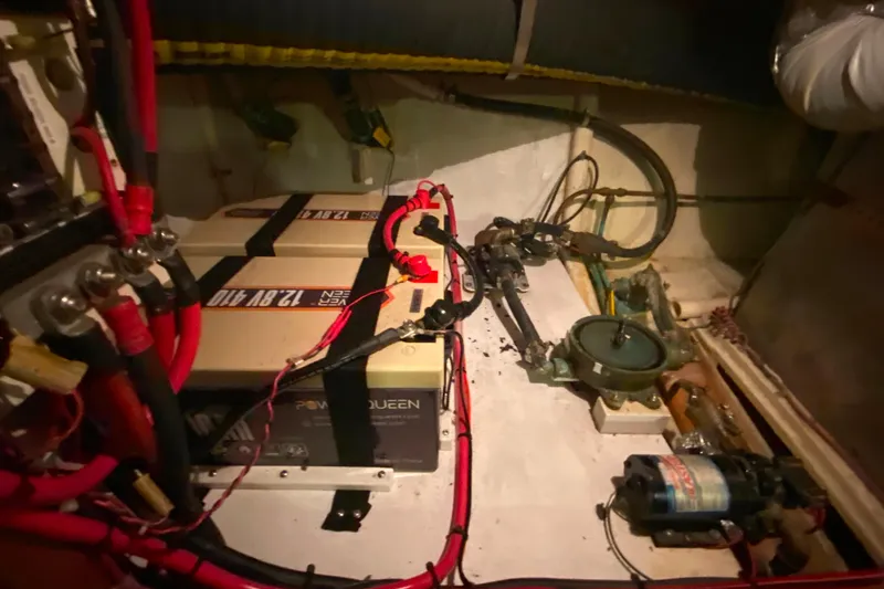 Slide: The Image of Engine room of 1980 Ocean Alexander 50 MK1 with batteries and wiring. - 78
