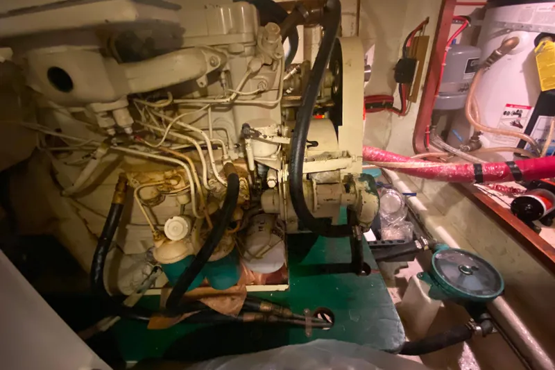 Slide: The Image of Engine room of a 1980 Ocean Alexander 50 MK1 yacht, showcasing mechanical components. - 82