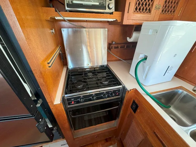Slide: The Image of Galley kitchen in 1980 Ocean Alexander 50 MK1 yacht with stove and sink. - 11