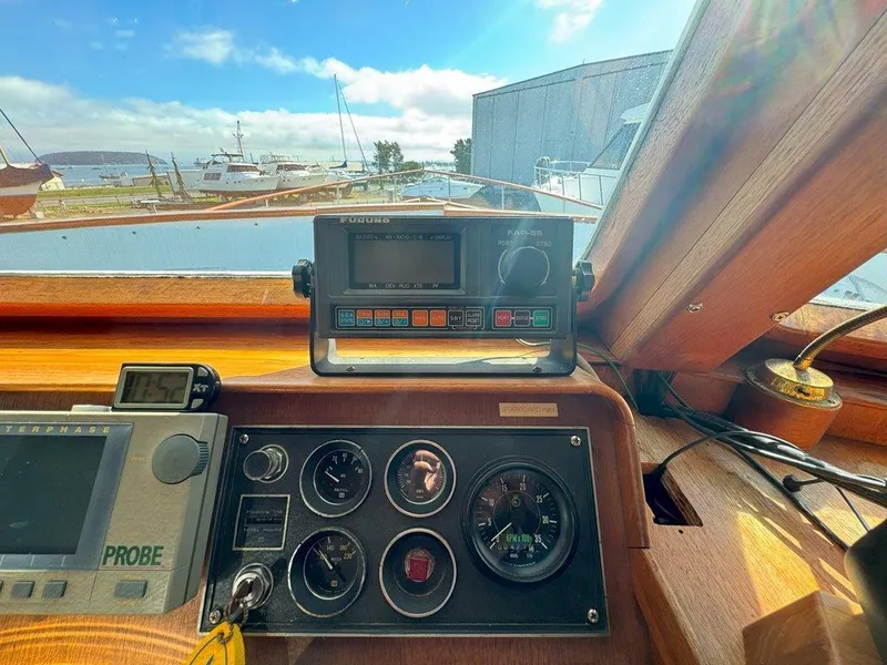 Slide: The Image of Cockpit view of 1980 Ocean Alexander 50 MK1 with navigation instruments and gauges. - 19