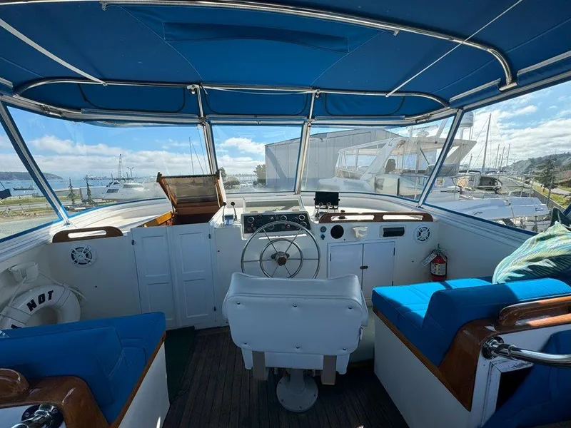 Slide: The Image of Interior view of 1980 Ocean Alexander 50 MK1 yacht cockpit with blue seating. - 35