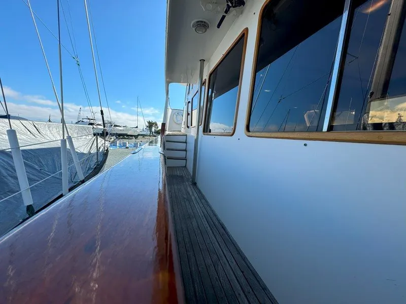 Slide: The Image of Side view of 1980 Ocean Alexander 50 MK1 yacht docked at marina. - 42