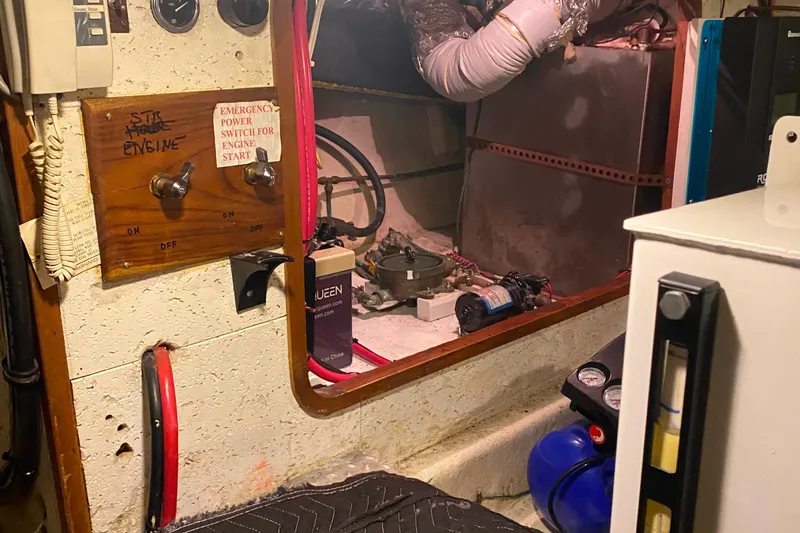 Slide: The Image of Engine room of 1980 Ocean Alexander 50 MK1 yacht with control panel and equipment. - 62