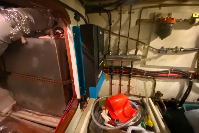 Slide: The Image of Engine room of 1980 Ocean Alexander 50 MK1 yacht with equipment and wiring. - 79