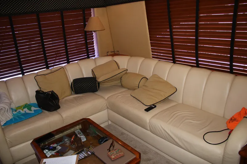 Slide: The Image of Luxurious 1999 Ocean Yachts interior with cream leather sofa and wooden blinds. - 11