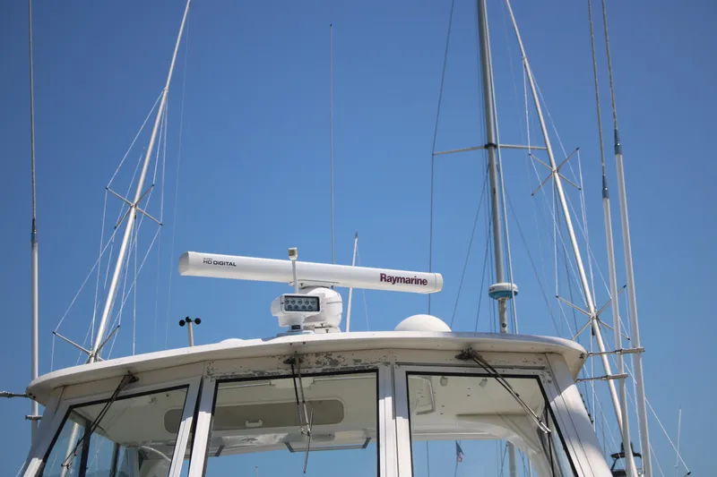 Slide: The Image of 1999 Ocean Yachts model with Raymarine radar against clear blue sky. - 15