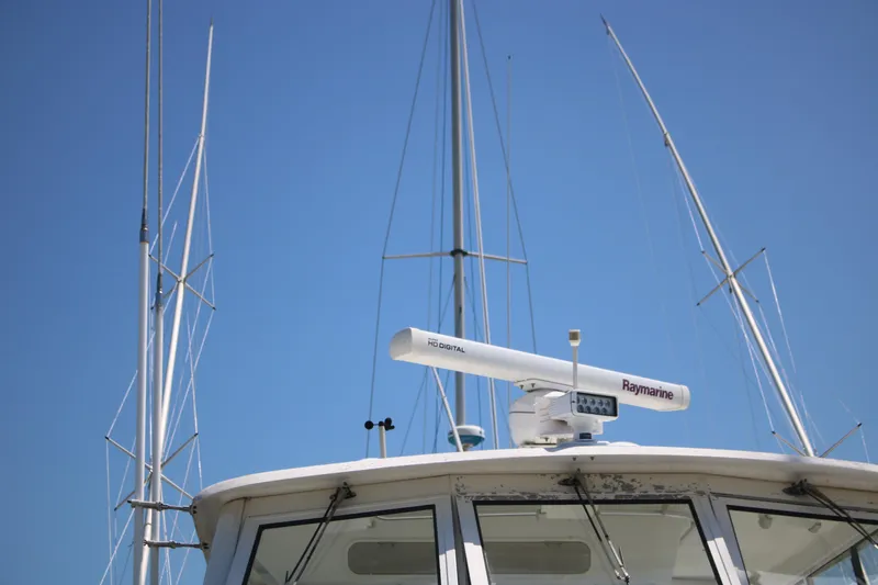 Slide: The Image of 1999 Ocean Yachts model with radar equipment against a clear blue sky. - 17