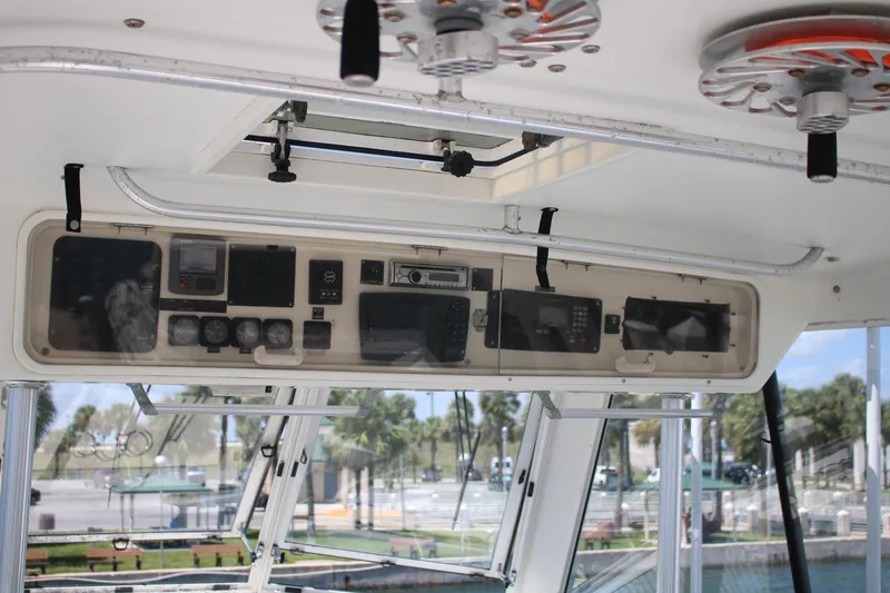 Slide: The Image of Control panel of a 1999 Ocean Yachts model, featuring navigation and communication equipment. - 25