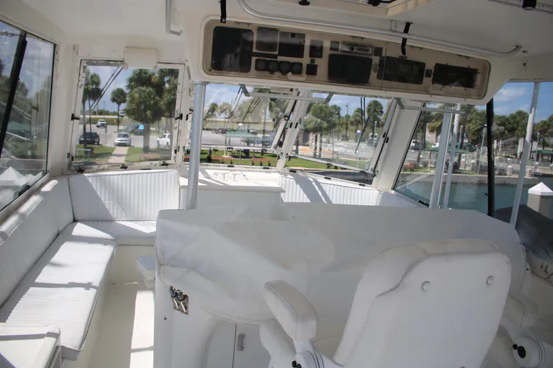 Slide: The Image of Interior view of a 1999 Ocean Yachts model, featuring a spacious cockpit with seating. - 26