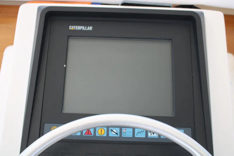 Slide: The Image of Caterpillar control panel on 1999 Ocean Yachts model, featuring various function buttons. - 29