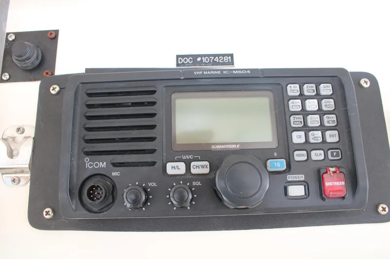 Slide: The Image of VHF marine radio on 1999 Ocean Yachts model, featuring controls and distress button. - 36