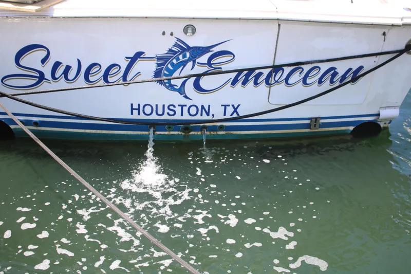 Slide: The Image of 1999 Ocean Yachts model with "Sweet EmOcean" name, docked in Houston, TX. - 41