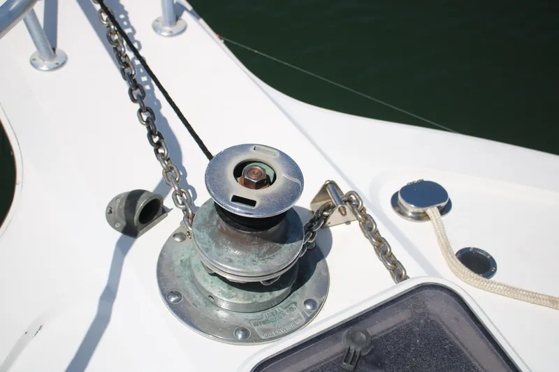 Slide: The Image of Anchor winch on 1999 Ocean Yachts model, showcasing deck details and chain mechanism. - 13