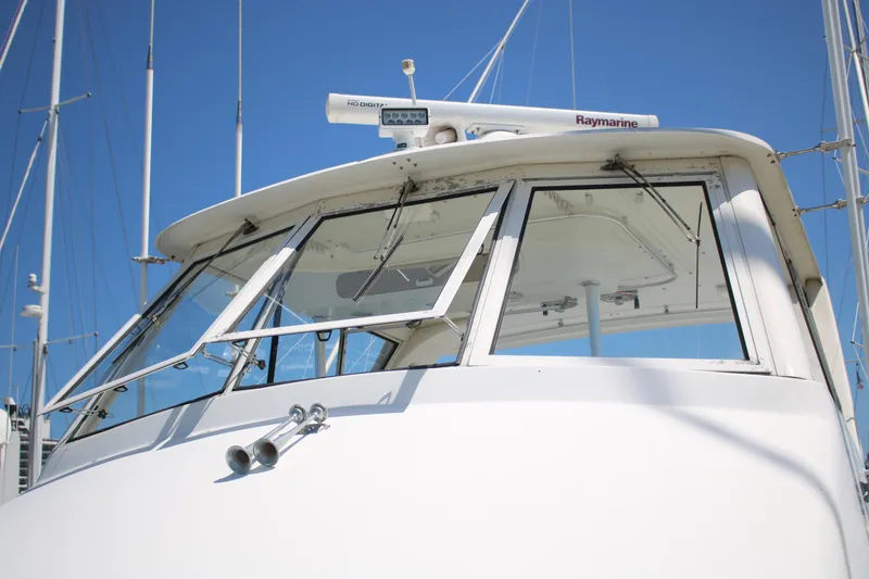 Slide: The Image of 1999 Ocean Yachts yacht with Raymarine equipment, featuring sleek windows and a white exterior. - 18