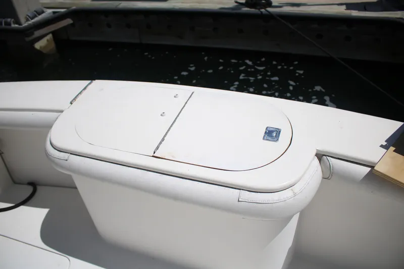 Slide: The Image of 1999 Ocean Yachts model, white deck storage compartment on a yacht. - 21