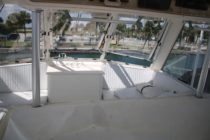 Slide: The Image of Interior view of a 1999 Ocean Yachts model, featuring a spacious seating area. - 23