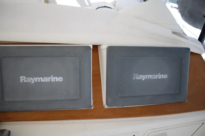 Slide: The Image of Raymarine equipment on 1999 Ocean Yachts model, featuring dual displays on wooden panel. - 30