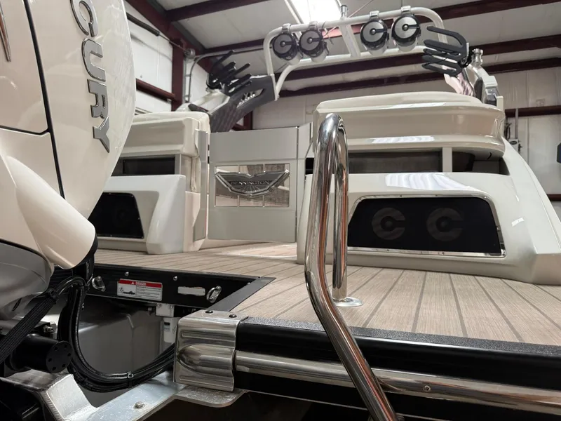 Slide: The Image of 2019 Bennington 25 QX Sport boat with Mercury engine, featuring sleek deck and modern design. - 10