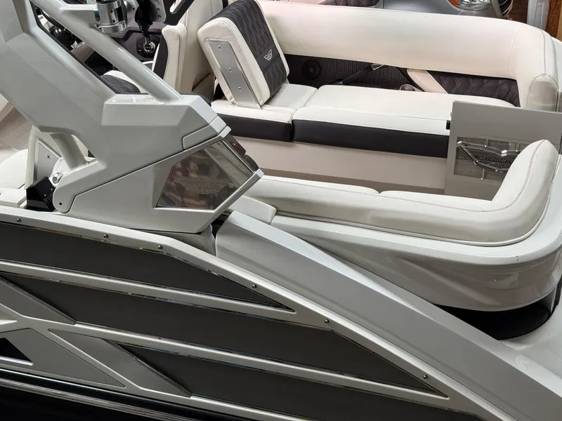 Slide: The Image of 2019 Bennington 25 QX Sport boat interior with sleek white seating and modern design. - 11