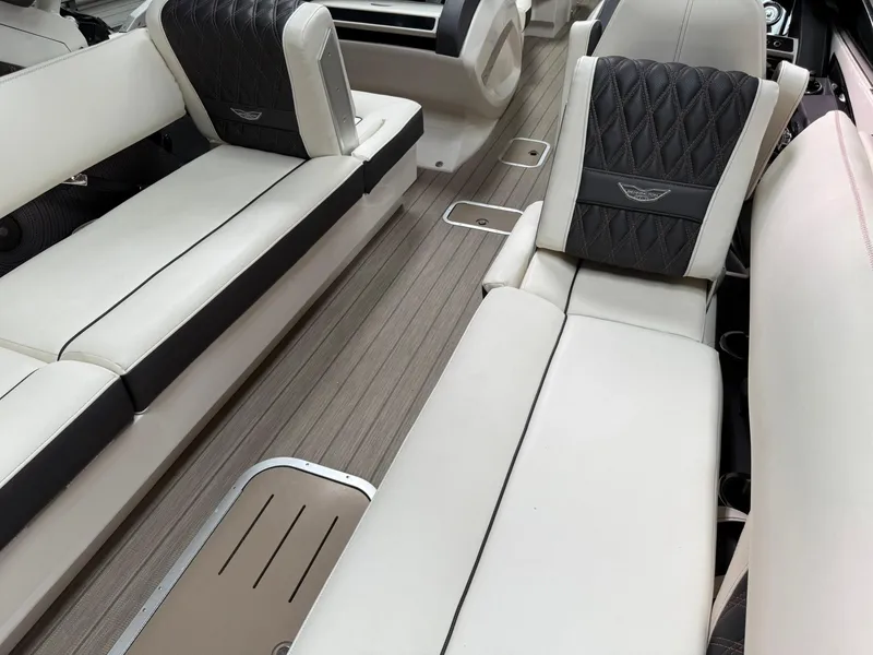 Slide: The Image of 2019 Bennington 25 QX Sport interior with luxurious seating and elegant design. - 13