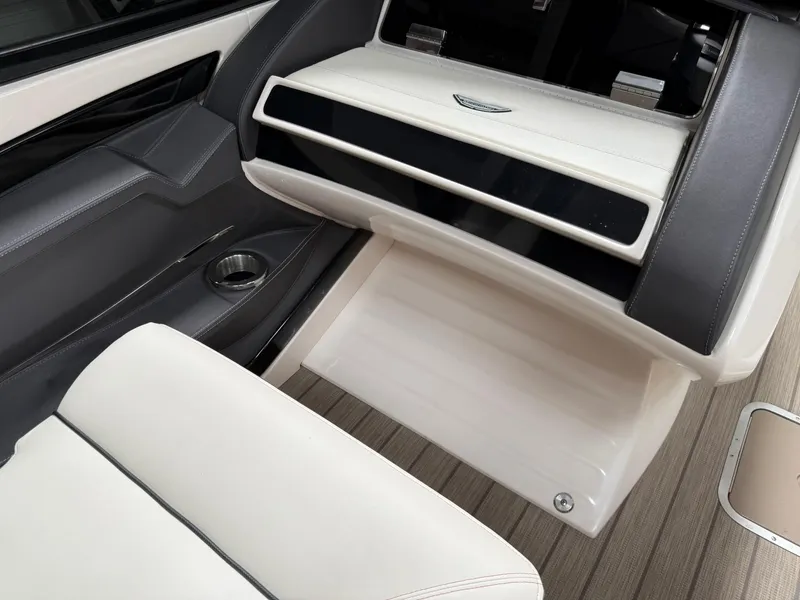Slide: The Image of Interior of 2019 Bennington 25 QX Sport boat with sleek seating and modern design. - 15