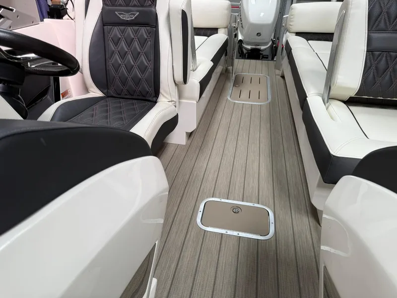 Slide: The Image of 2019 Bennington 25 QX Sport interior with luxurious seating and sleek design. - 18