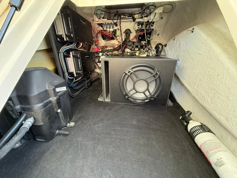 Slide: The Image of Interior view of 2019 Bennington 25 QX Sport boat showing wiring and equipment. - 32