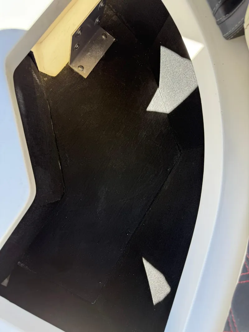 Slide: The Image of 2019 Bennington 25 QX Sport interior compartment with black lining and metal hinge. - 36