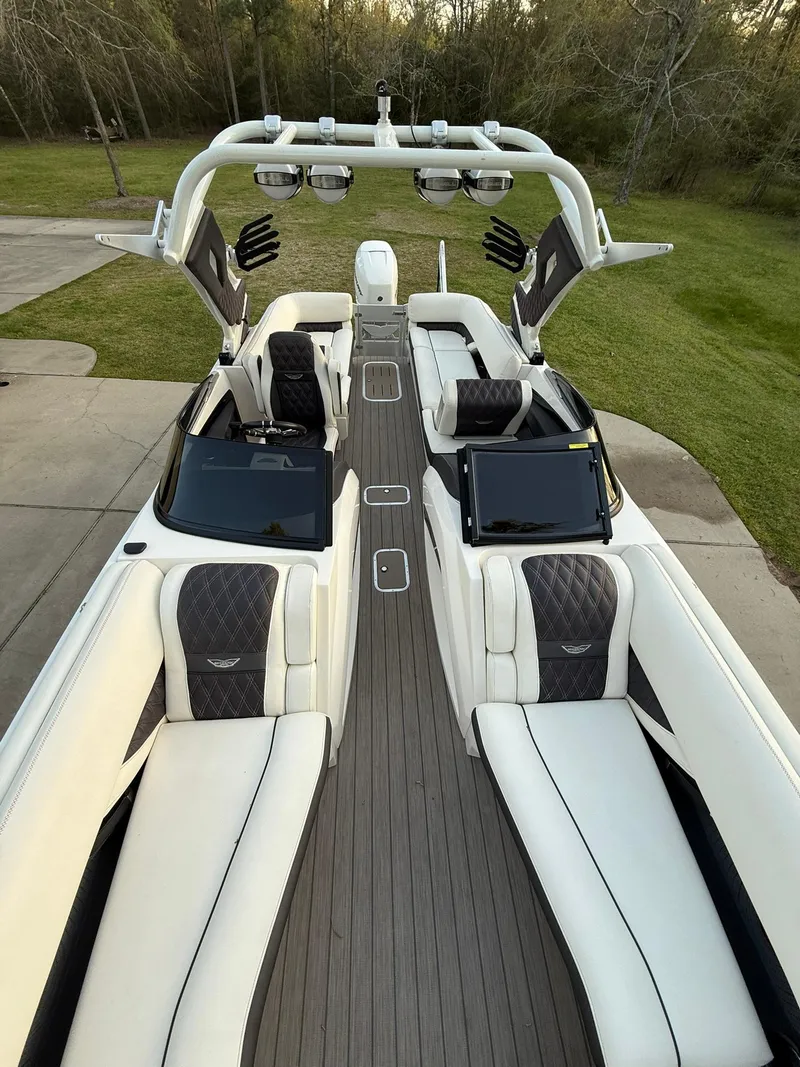 Slide: The Image of 2019 Bennington 25 QX Sport boat with luxurious seating and sleek design. - 7
