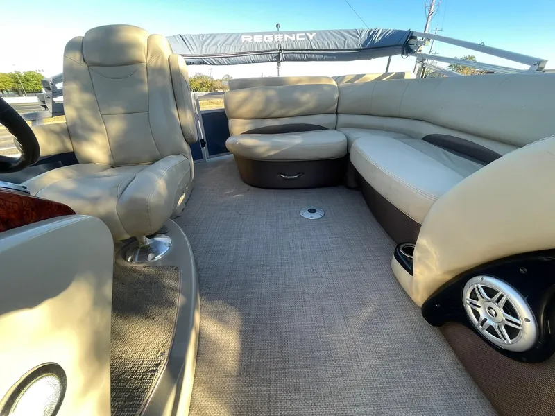 Slide: The Image of Luxurious interior of 2017 Regency 220 DL3 pontoon boat with plush seating. - 13