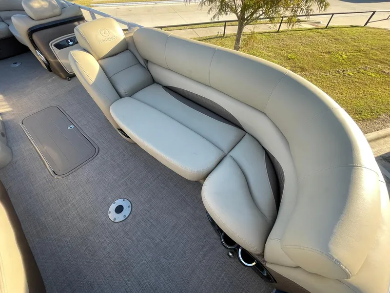 Slide: The Image of Luxurious seating on 2017 Regency 220 DL3 pontoon boat with plush upholstery. - 14