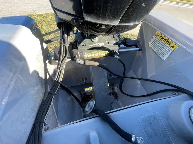 Slide: The Image of 2017 Regency 220 DL3 boat engine compartment with SeaStar hydraulic steering system. - 22