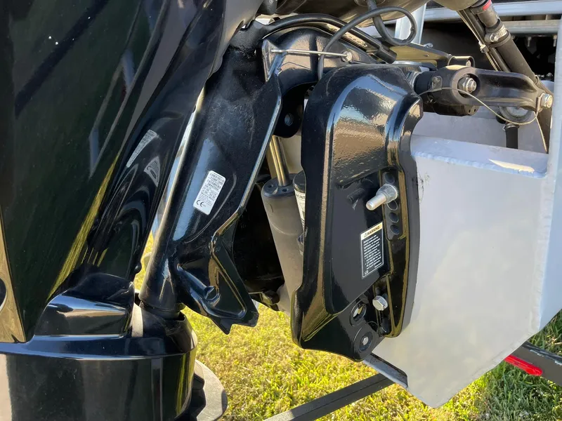 Slide: The Image of Close-up of a 2017 Regency 220 DL3 boat motor component, showcasing mechanical details. - 23