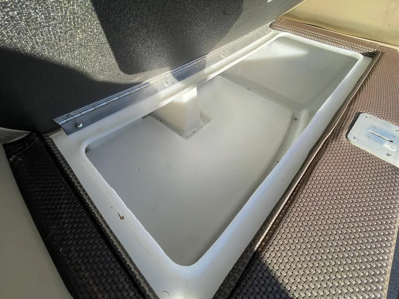 Slide: The Image of Storage compartment on 2017 Regency 220 DL3 boat, featuring durable materials and sleek design. - 27