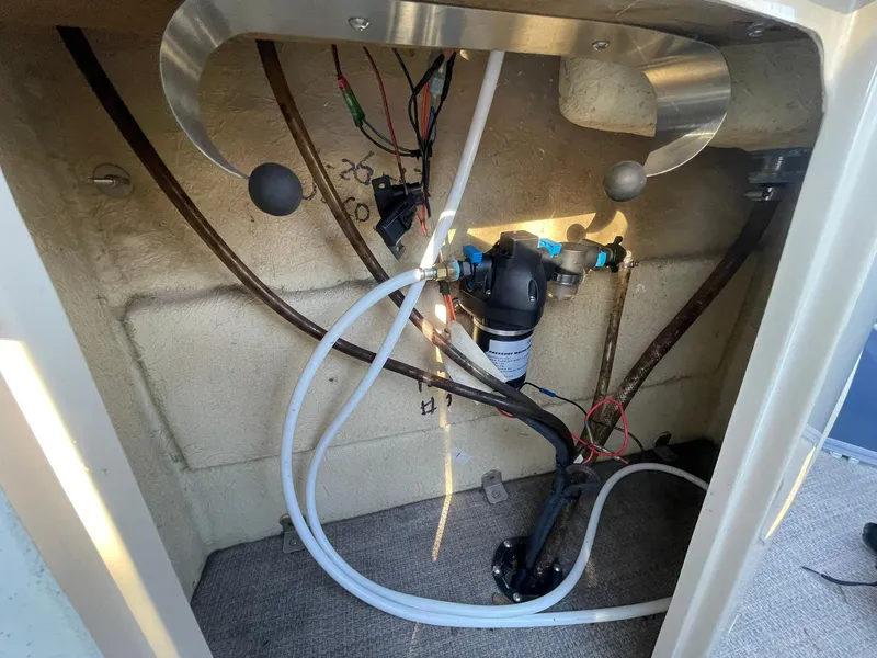 Slide: The Image of 2017 Regency 220 DL3 boat interior wiring and plumbing setup. - 29