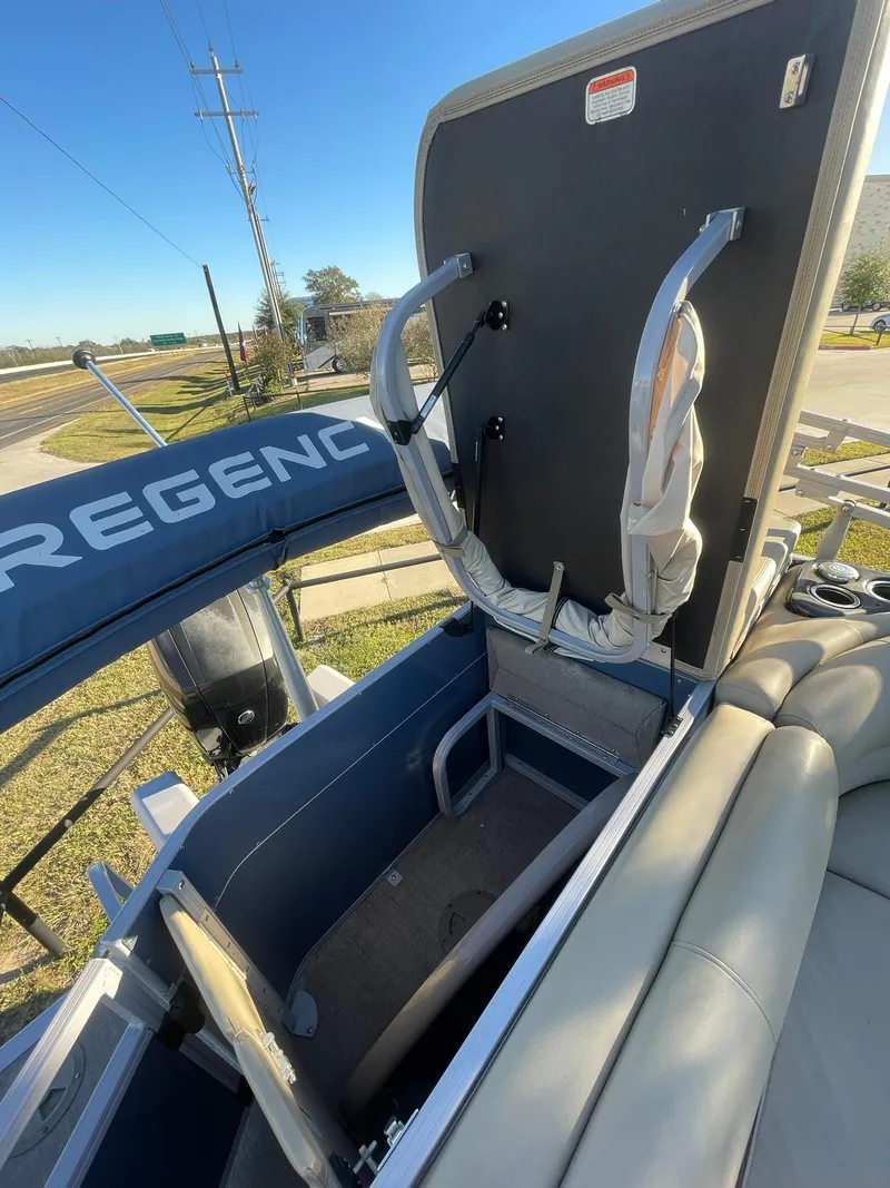 Slide: The Image of 2017 Regency 220 DL3 boat with open storage compartment and seating. - 30