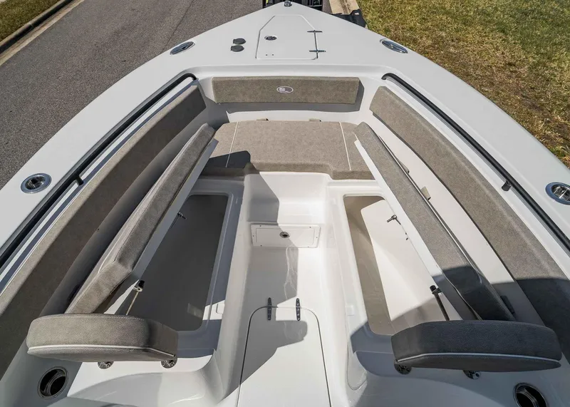 Slide: The Image of 2025 Sea Hunt Gamefish 25 boat interior with cushioned seating and storage compartments. - 10