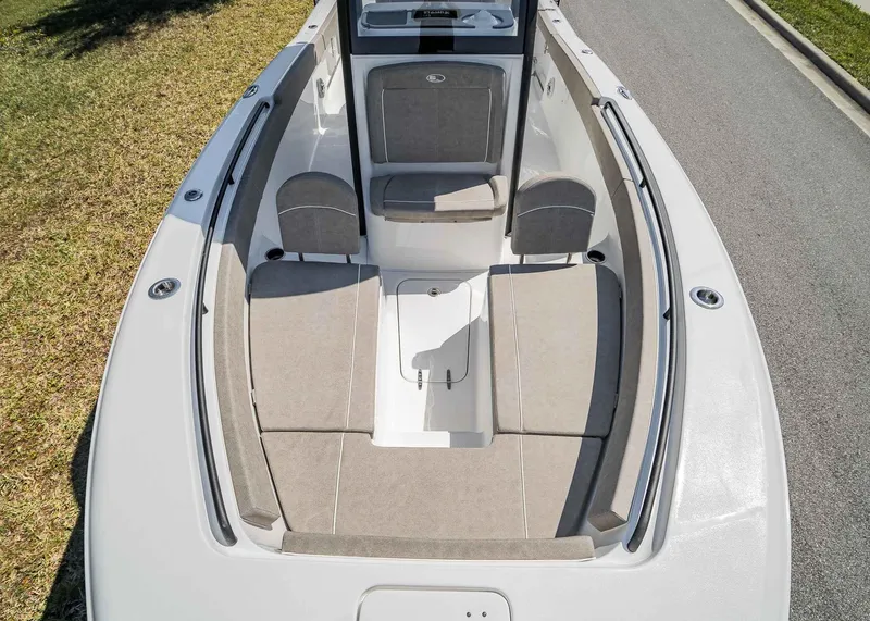 Slide: The Image of 2025 Sea Hunt Gamefish 25 boat interior with cushioned seating and sleek design. - 11
