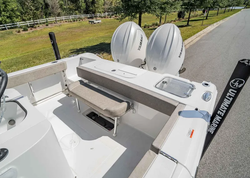 Slide: The Image of 2025 Sea Hunt Gamefish 25 boat interior with dual Yamaha engines and seating area. - 6