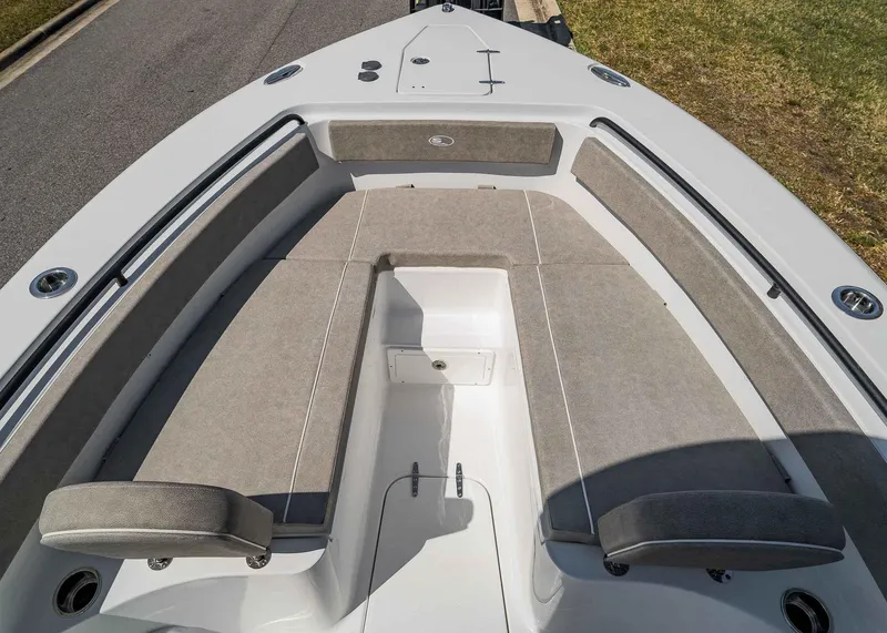 Slide: The Image of 2025 Sea Hunt Gamefish 25 boat interior with cushioned seating and storage compartments. - 9