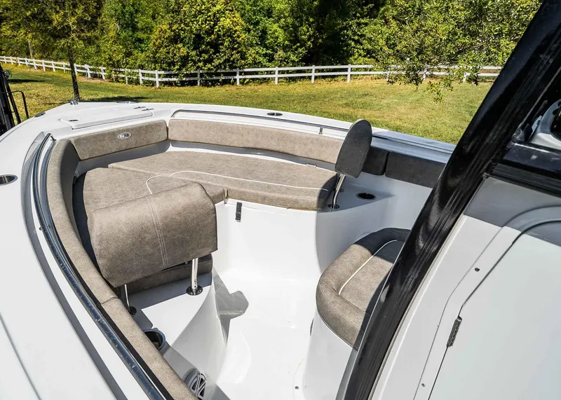 Slide: The Image of 2025 Sea Hunt Ultra 219 boat interior with cushioned seating and sleek design. - 10