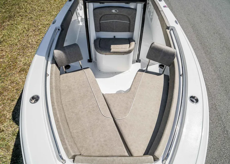 Slide: The Image of 2025 Sea Hunt Ultra 219 boat interior with cushioned seating and sleek design. - 11